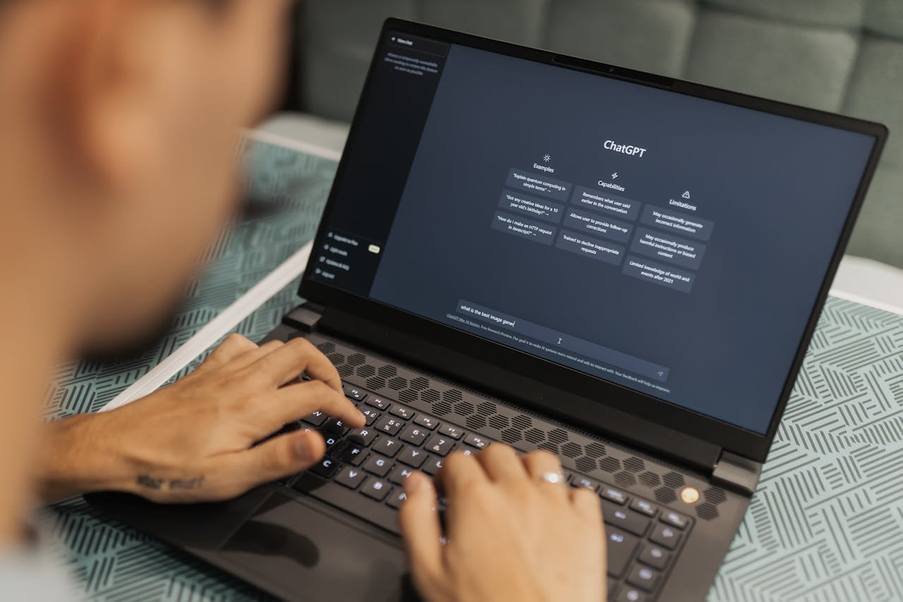 Man Using Laptop wit Chat GPT, future of web design
